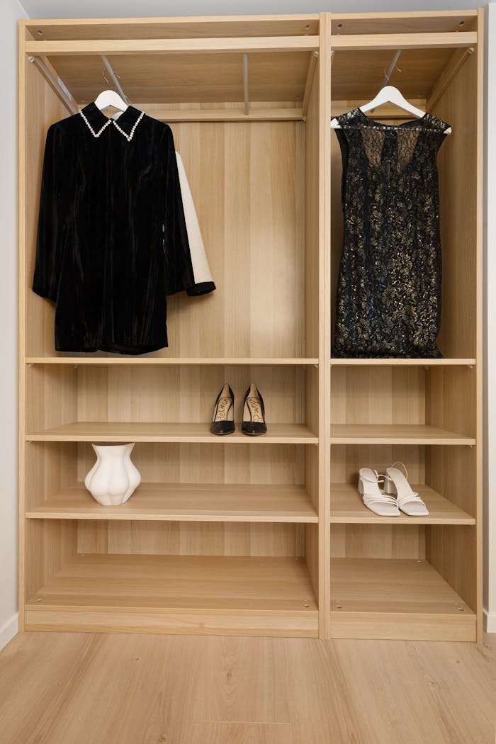 A minimalist wardrobe showcasing elegant dresses and stylish heels, emphasizing simplicity and elegance.